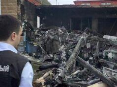 Сотрудник СК РФ работают на месте крушения вертолета Ка-226 в поселке Ачи-Су в республике Дагестан - РИА Новости, 1920, 26.03.2026